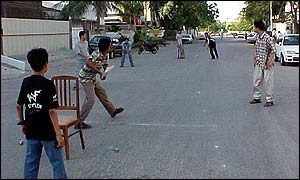A street cricket scene in Pakistan