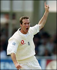 Michael Vaughan takes the wicket of India's Sachin Tendulkar during the second Test in 2002