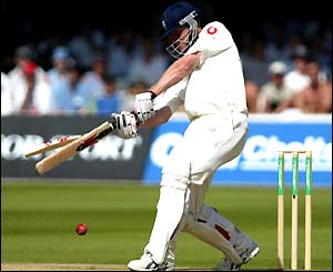Andrew Flintoff attempts to crack the ball to the boundary but only succeeds in breaking his bat