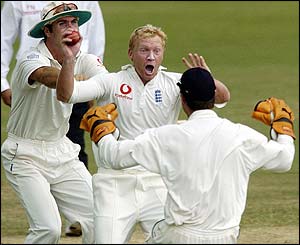 Gareth Batty celebrates claiming the wicket of Chris Gayle
