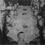 Hazel (left) attends to the underprivileged children