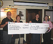 Pete and Emma hand over their charity cheques