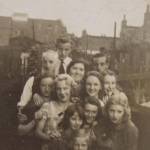 In this picture Irene and her family are in their back garden at Cresset Road. Irene is the girl on the right - holding her finger to her mouth