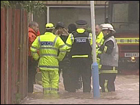 Emergency services in flooded street