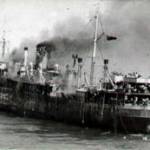 The Empire Patrol on fire in the Med.