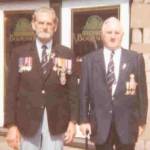 Harold Limeburner and friend with full regalia of medals -- he is wearing his medals are on his left and his brother Jack's medals on his right.