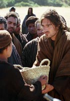 Jesus receiving a basket of fish