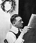 Adolf Hitler in December 1924. He sits reading a paper during his imprisonment in Landsberg Jail, after the failure of the Munich Putsch