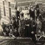 One of our Churchill tanks on VE day carrying loads of girls around the Belgian town town of Gheel. We were rewarded with a kiss as we oulled them up!