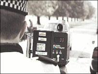 Policeman with speed camera