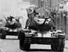 Armed soldiers ride atop tanks in the streets of Santiago on 12 September 1973, as Army Commander General Augusto Pinochet Ugarte is sworn in as President 