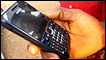 A man in the African village of Gitata holds an internet-enabled mobile phone