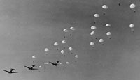 Military planes drop their paratroops