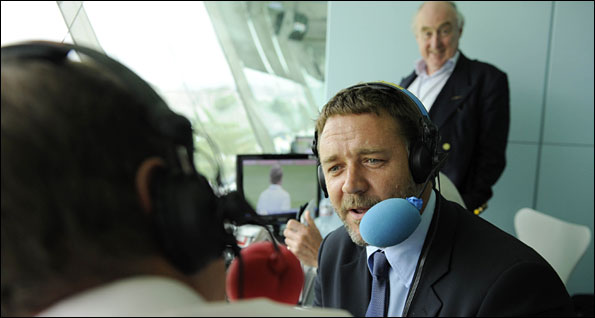 Russell Crowe speaks to Jonathan Agnew as Henry Blofeld looks on