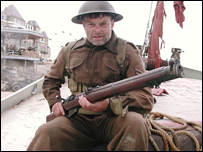 Ron Everett in character on the beach