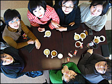 Korean people with mugs
