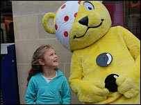 Pudsey Bear and child