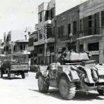 3rd The King’s Own Hussars waiting to take suspects to Rafan Detention Camp Tel Aviv September 1946. Suspects lined up on the roadside