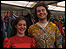 Two Latitude Festival goers looking dapper in fancy dress