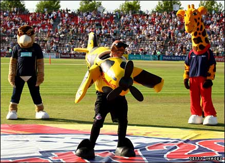 Kent mascot 'Bomber the Spitfire' takes part in a 'dance-off' at finals day, watched by Hampshire's Harry Hawk and Lancashire's Lanky the Giraffe