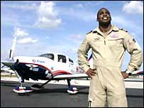 Barrington standing in front of his plane