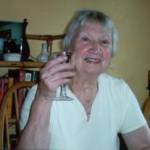 June 2005: Winnie toasting some of her happy wartime memories, her family, and friends. During the war, Winnie used to toast the King and Queen with a small glass of lemonade while delivering the beer with Mr Dewhurst, 'Ark Royal' and 'Hood'.