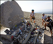 Competitors stand at the Tom Simpson Memorial 18 June 2005 at the Mont Ventoux