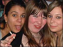 Clubbers stop dancing to pose for a pic.