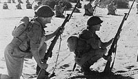 Australian troops await the signal to crash the defences at Bardia. These troops captured nearly 40,000 prisoners during Operation Compass