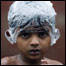 Boy covers his head with a plastic bag